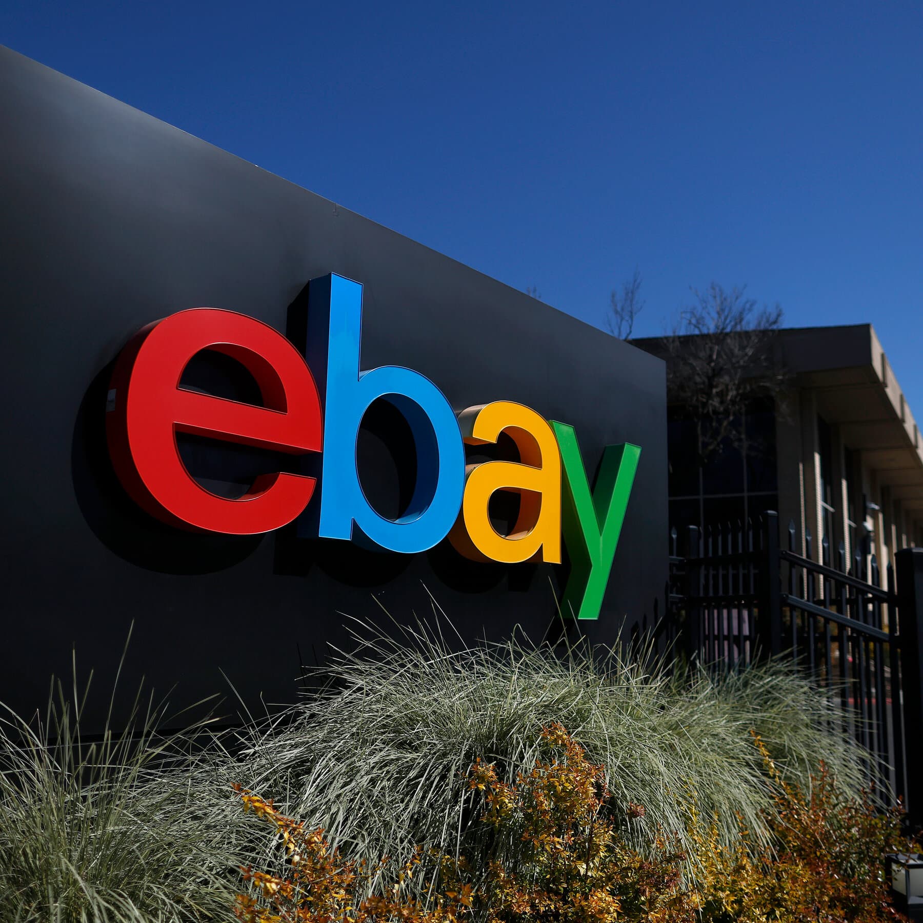EBay and GameStop logos with a financial graph background