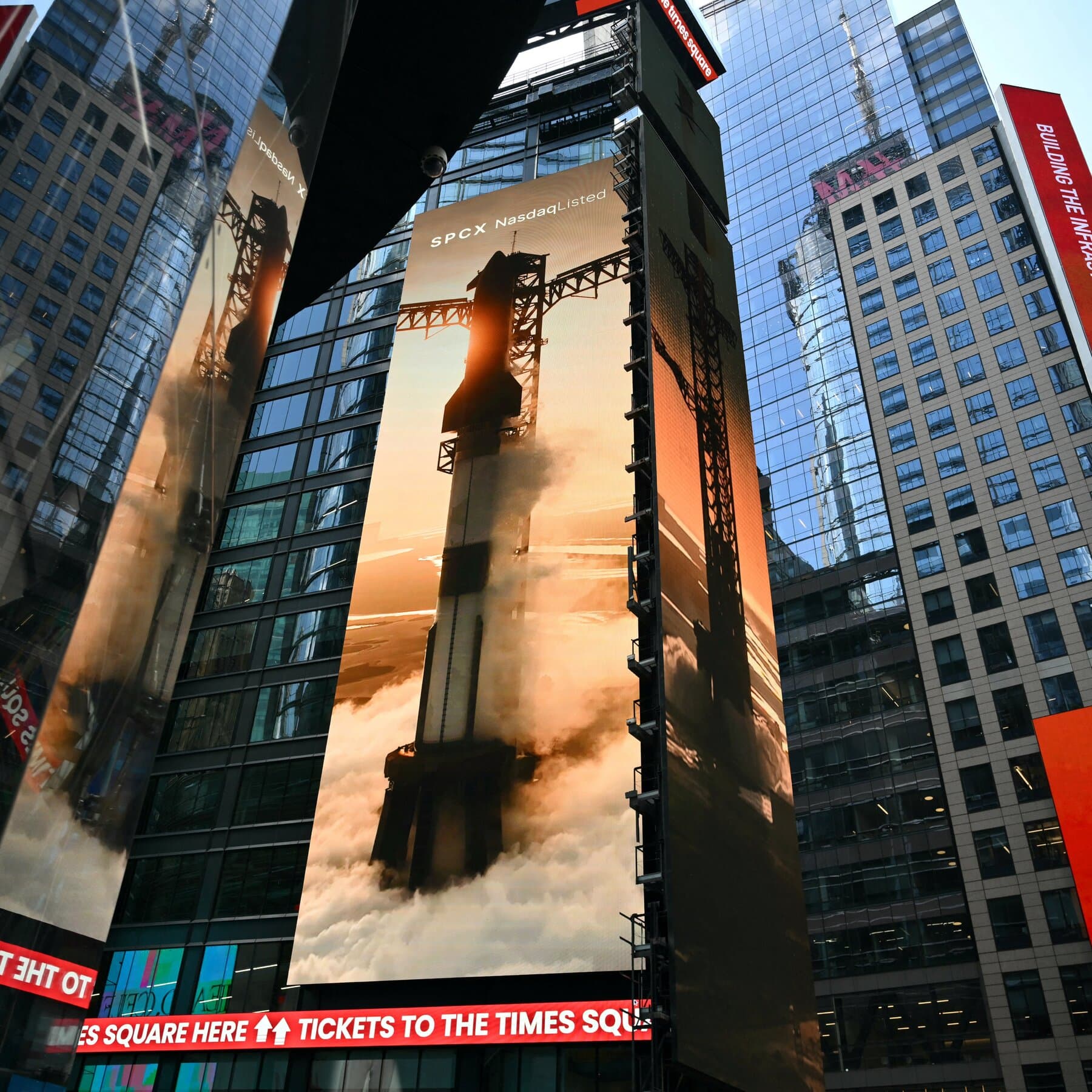 SpaceX logo with a backdrop of stock market graphs and Bitcoin symbols.