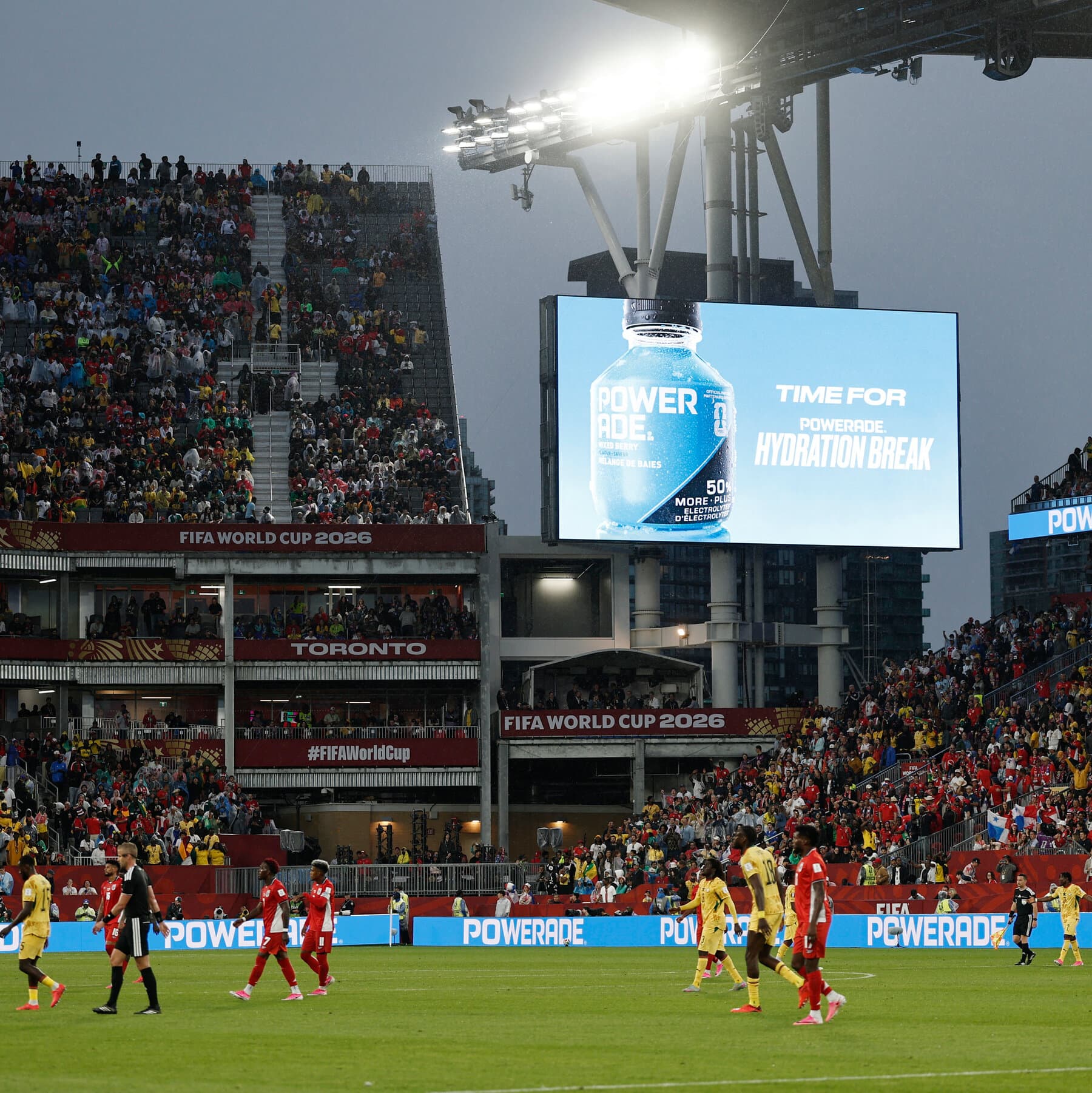 Players taking a hydration break during the 2026 World Cup match.