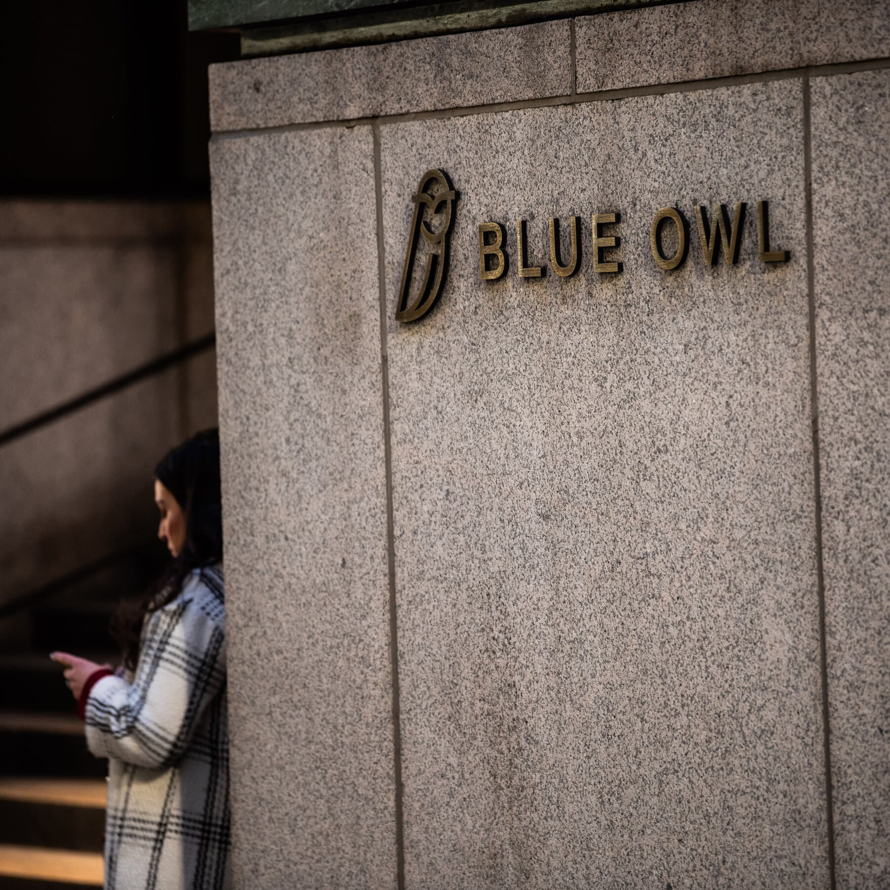 Blue Owl logo with financial graphs depicting market pressures
