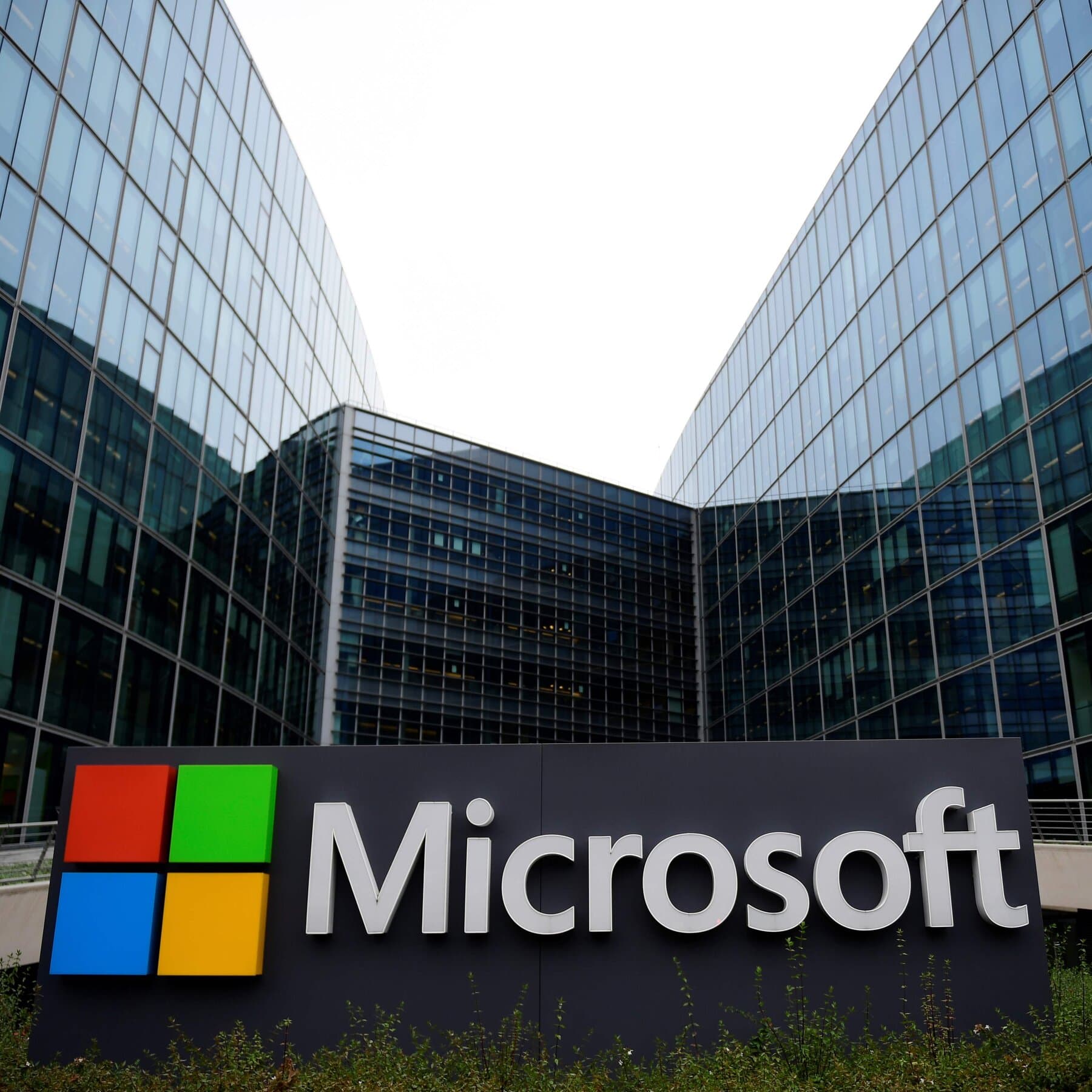 Microsoft logo with a backdrop of European tax regulations