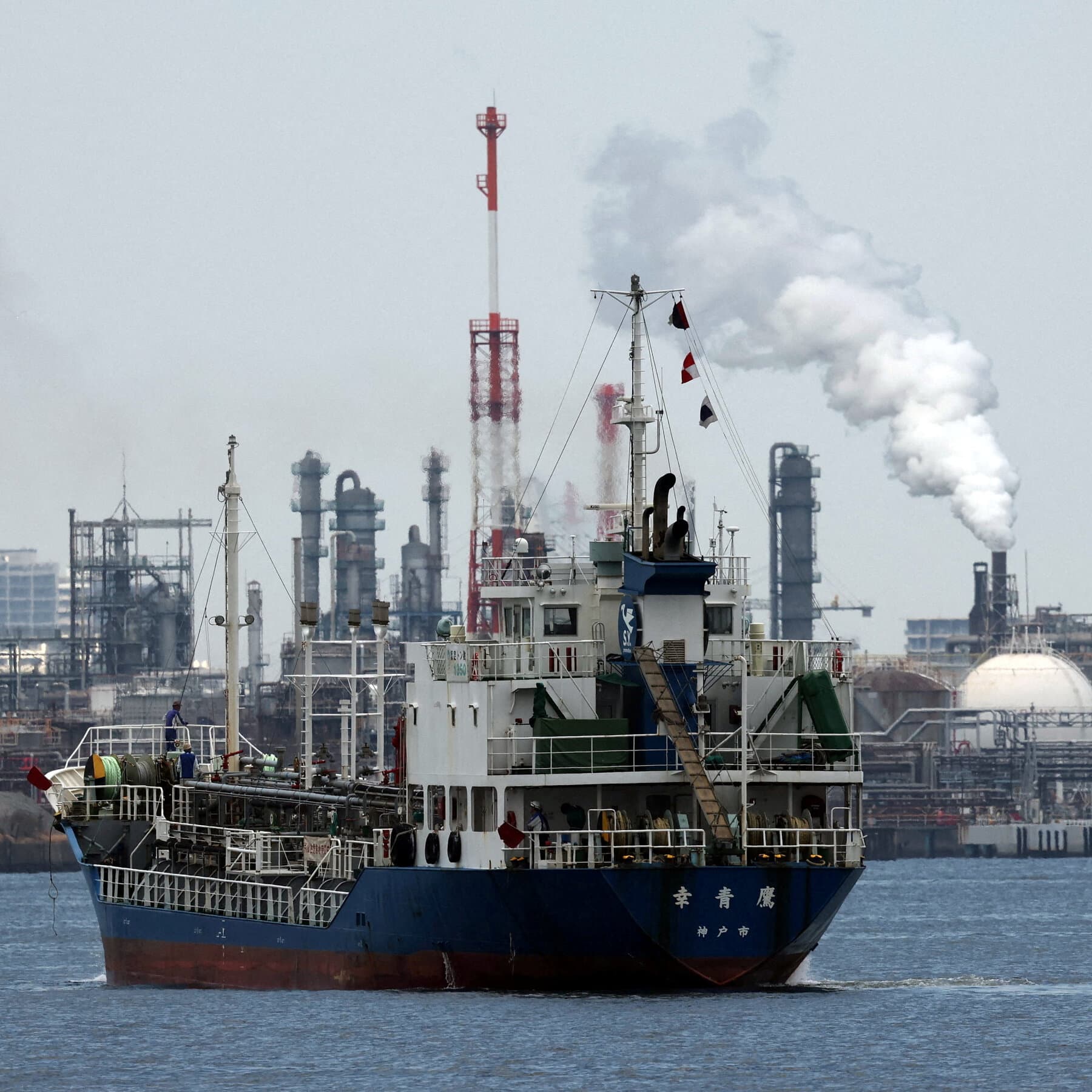 Oil tankers navigating the Strait of Hormuz amidst geopolitical tensions.