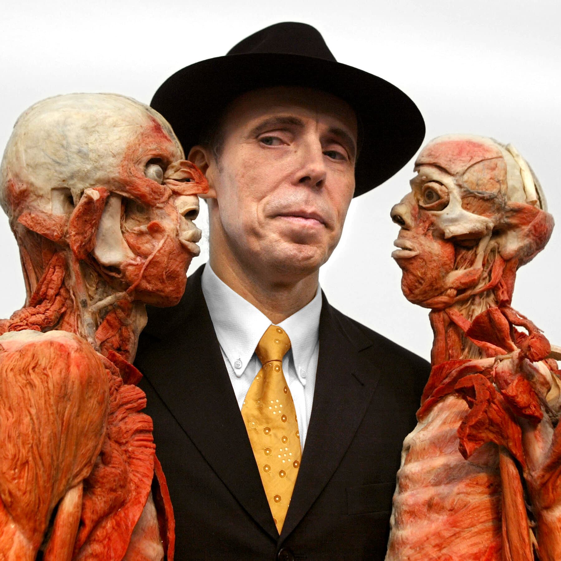 Gunther von Hagens presenting a Body Worlds exhibition with preserved human bodies.
