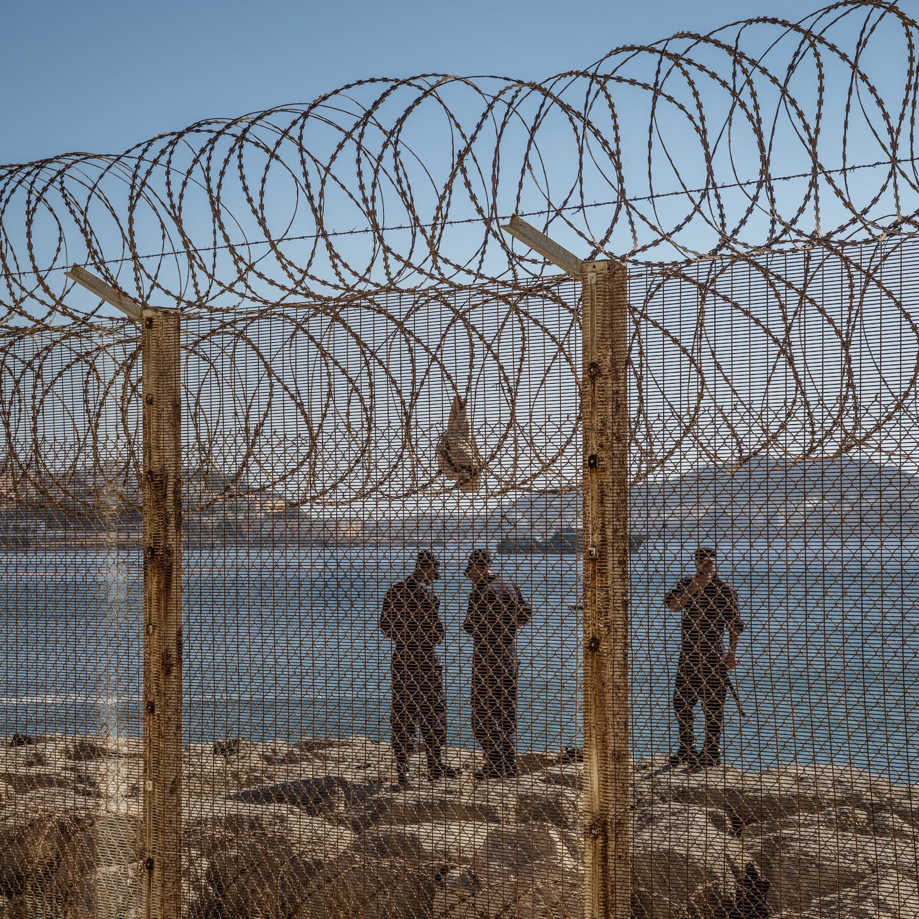 Migrants attempting to cross into Ceuta amidst rising tensions.