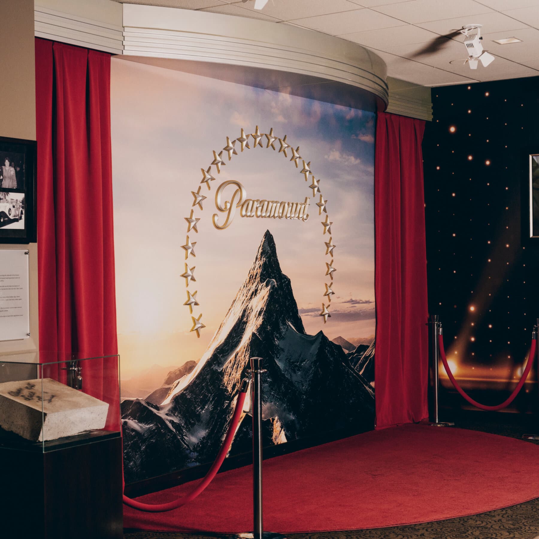 Paramount and Warner Bros. Discovery logos with legal scales in the background