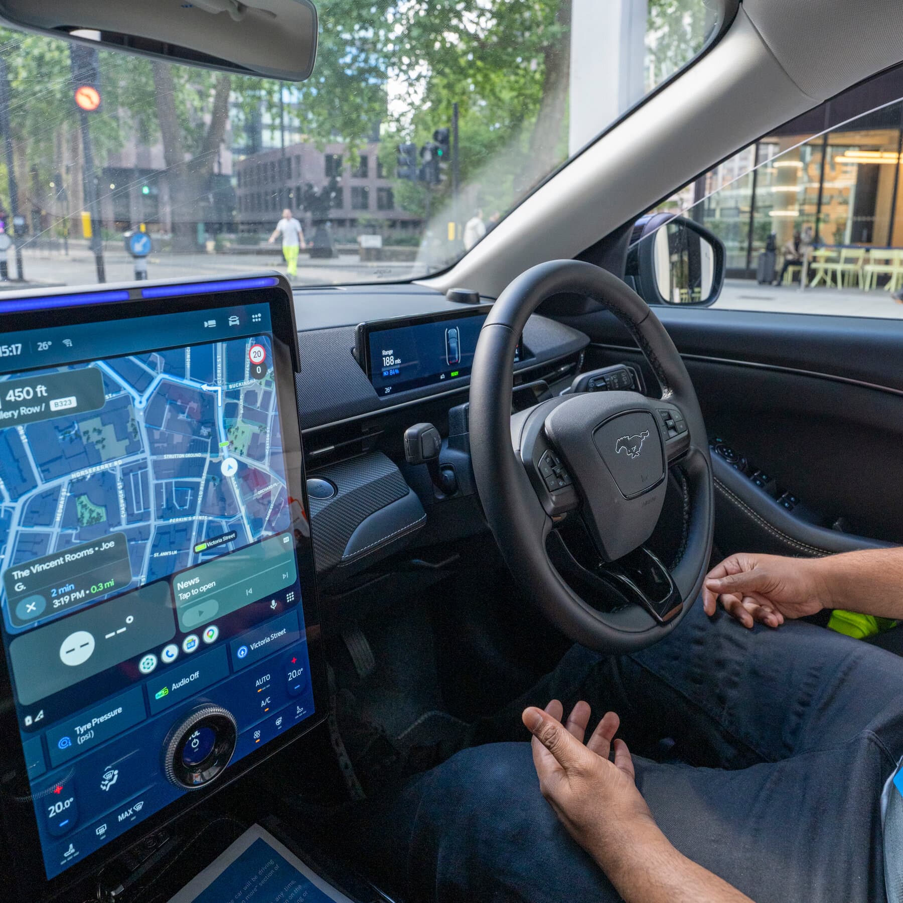 A Wayve-equipped Ford Mustang Mach-E operating as a robotaxi in London with a safety driver.