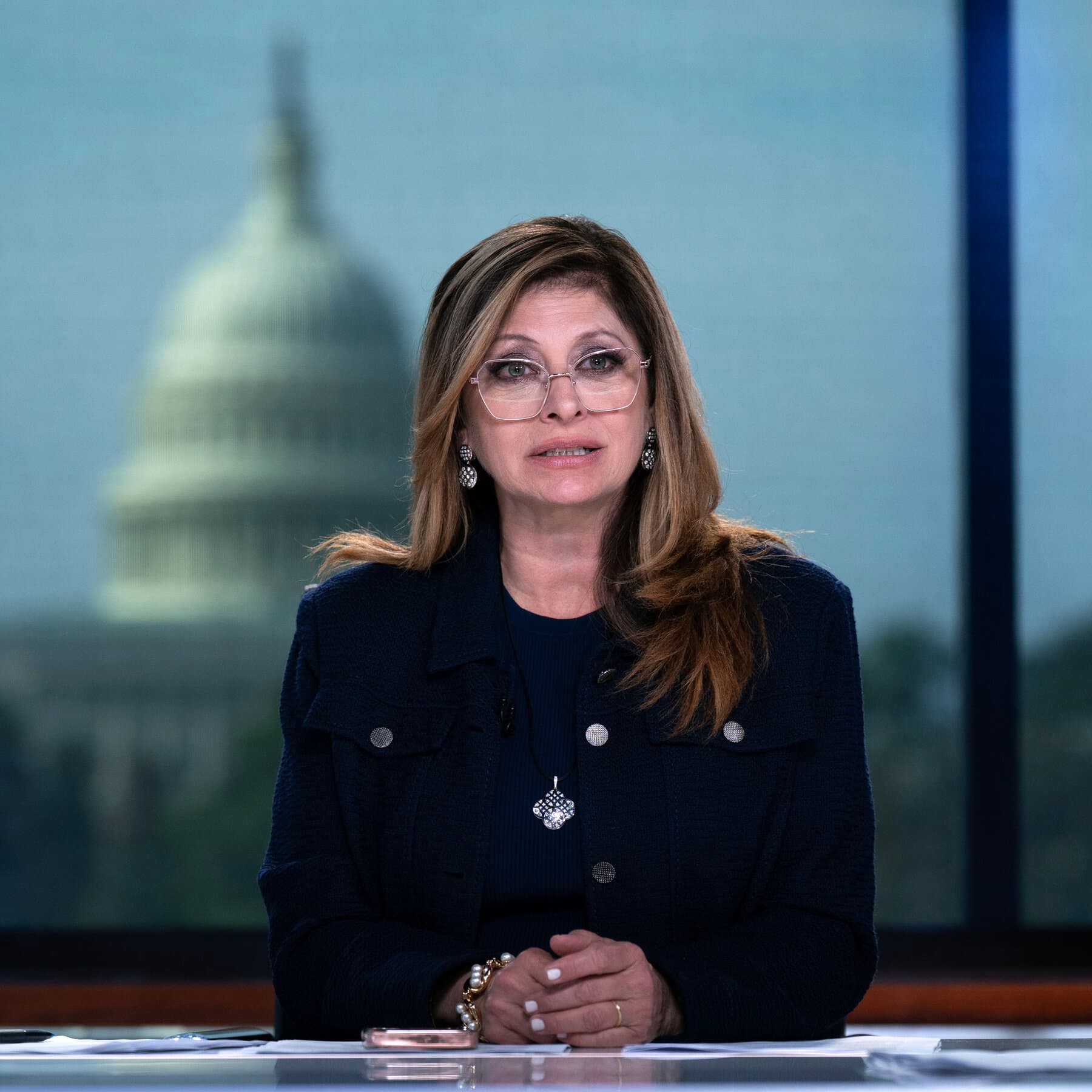 Maria Bartiromo on set, highlighting her influence and viewership statistics at Fox News.