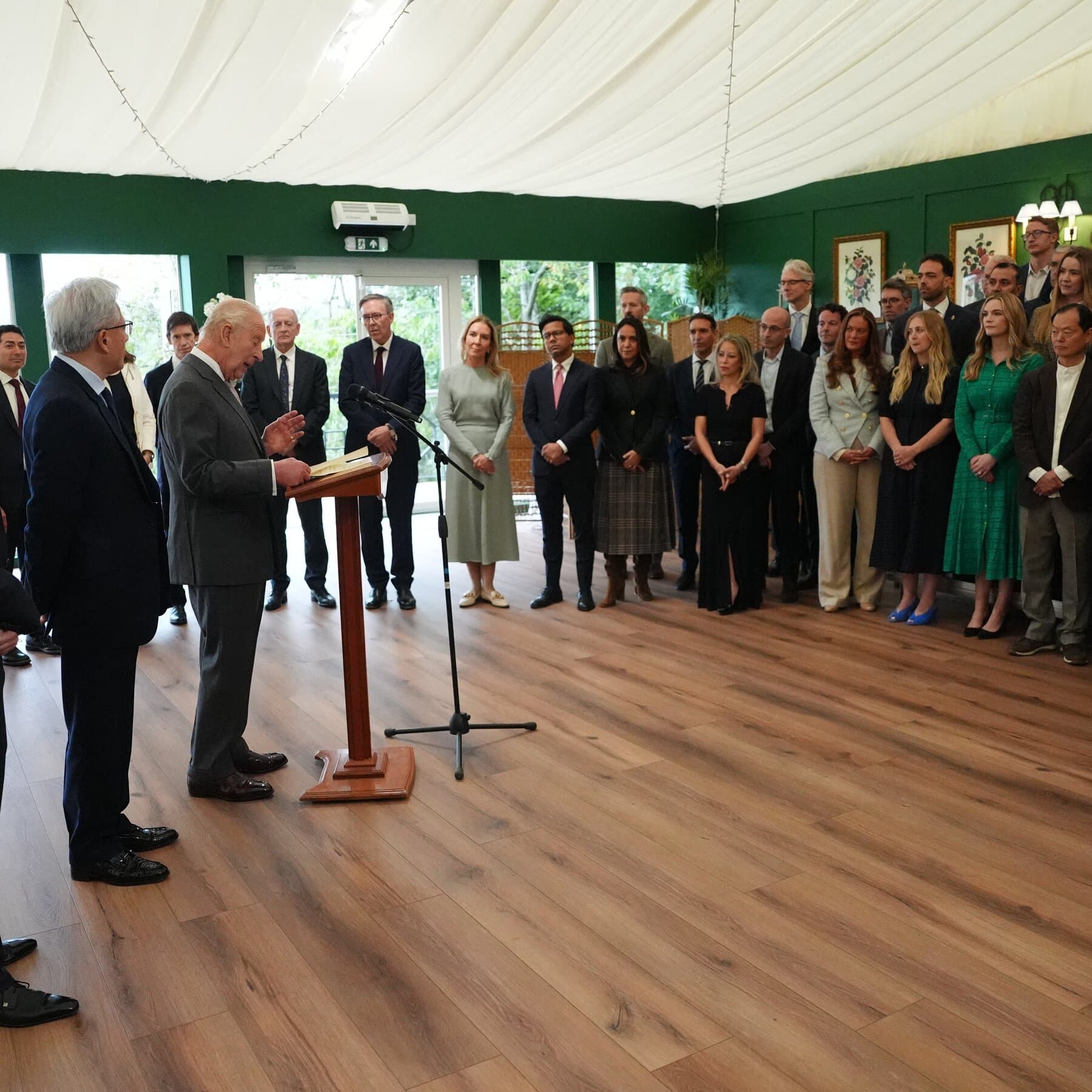 A conceptual graphic showing King Charles III meeting AI executives to discuss safety risks in artificial intelligence.