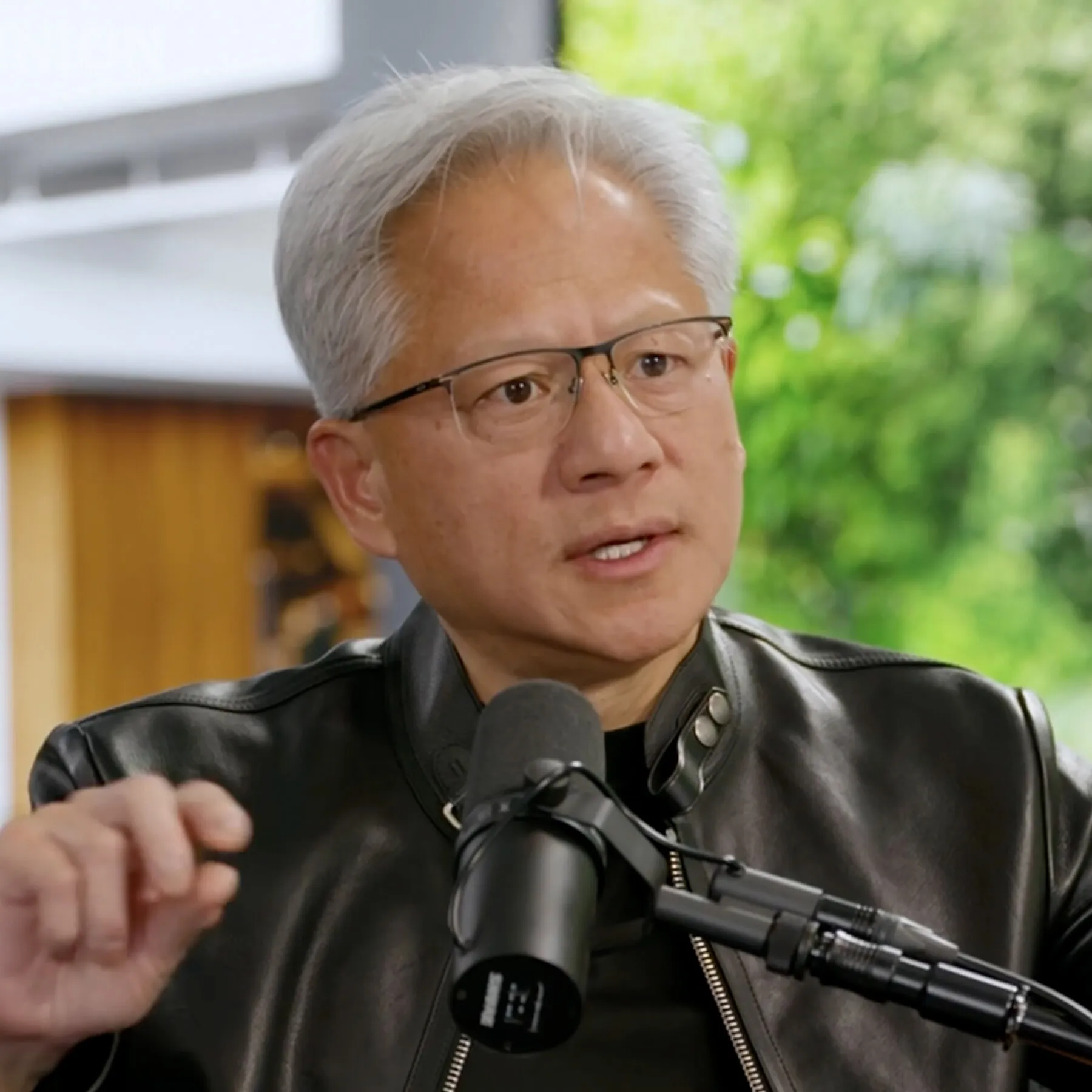 A graphic showing the shift in AI safety discourse from alarmism to engineering solutions, featuring Jensen Huang.
