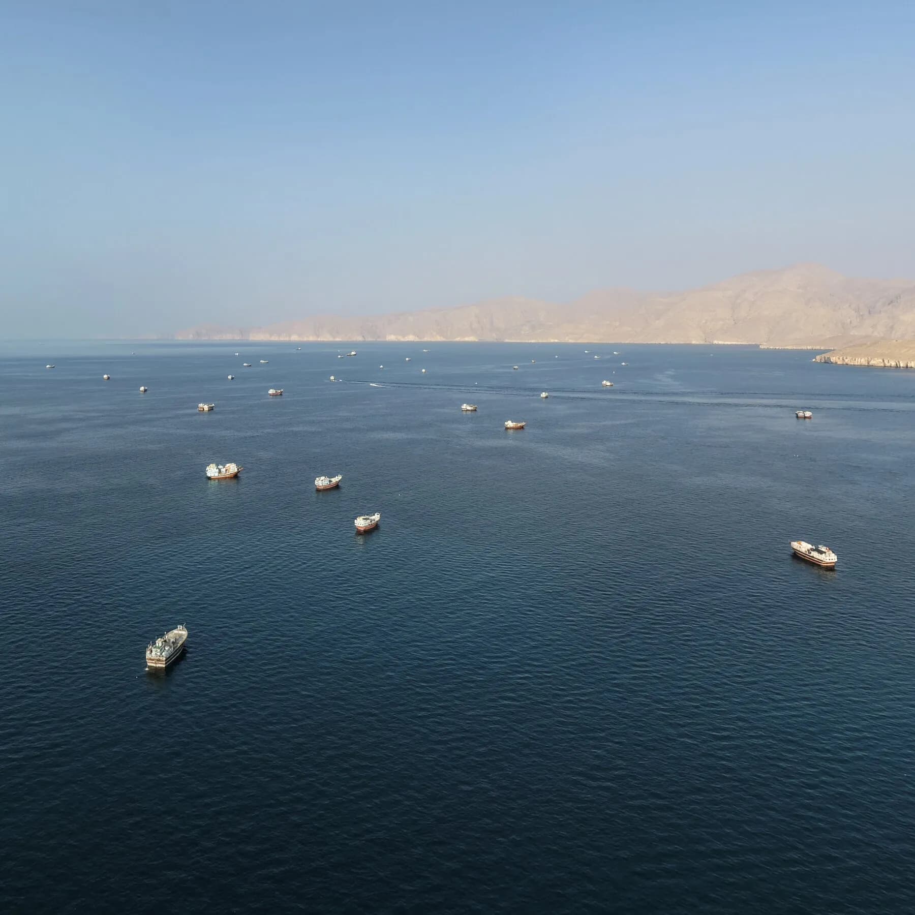 Infographic showing tanker attacks in the Strait of Hormuz and their impact on global energy prices.