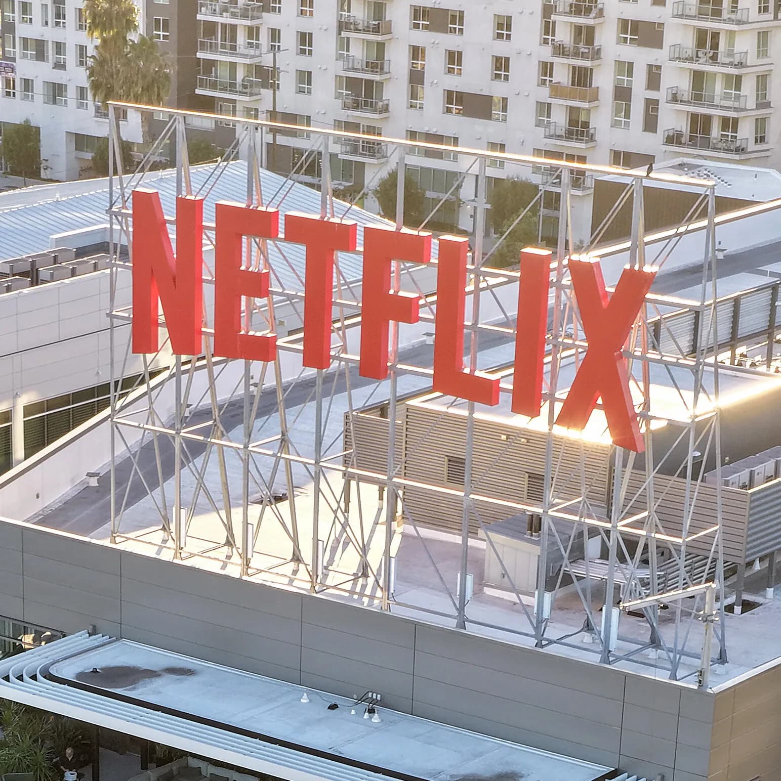 Infographic illustrating Netflix's workforce reduction and its impact on the streaming industry.