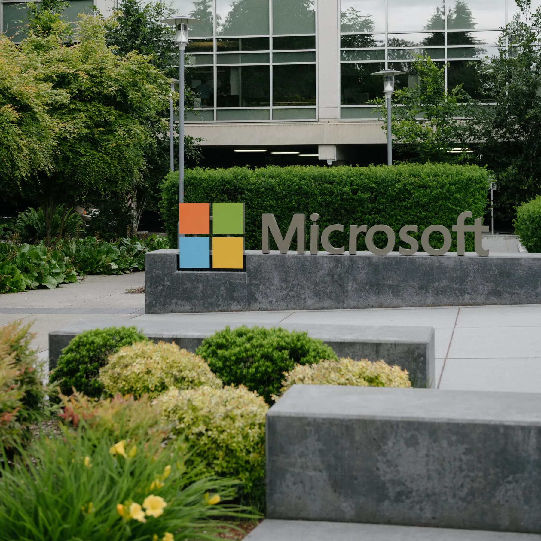 Bold typography graphic displaying Microsoft Q1 earnings net income figure of 36.6 billion dollars on a dark slate background