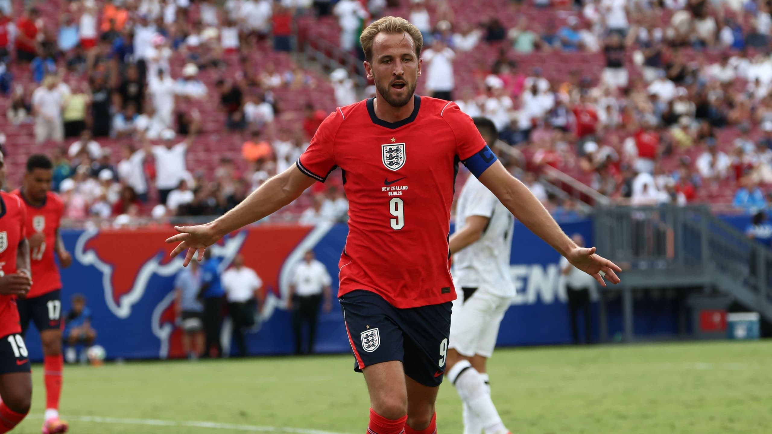 Harry Kane celebrating a goal during a match with Bayern Munich.