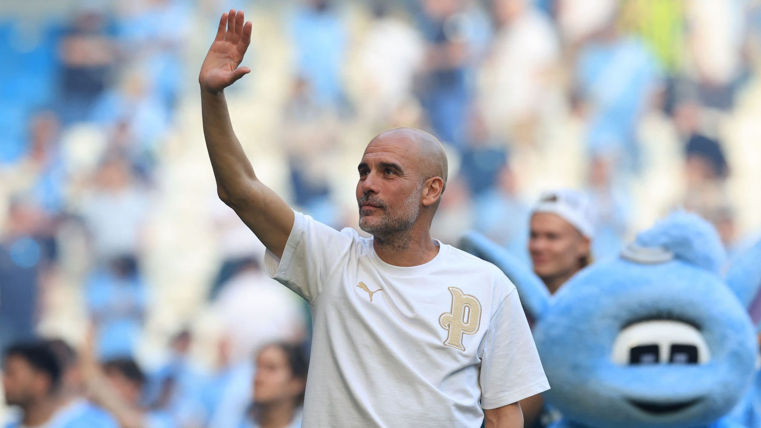 Pep Guardiola during a press conference discussing coaching opportunities.
