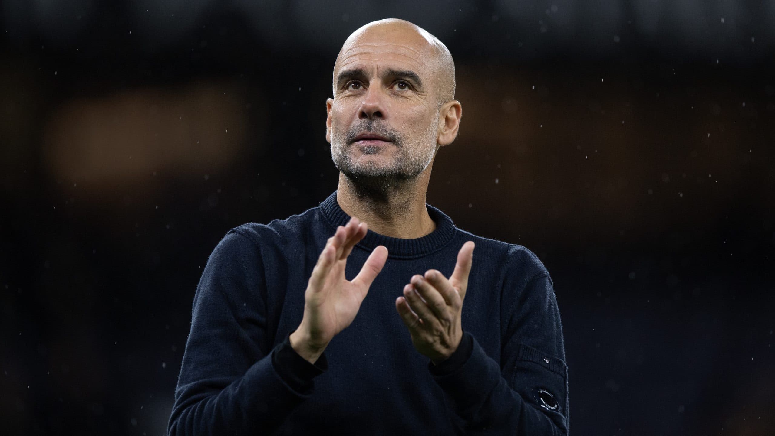 Pep Guardiola during a press conference discussing coaching opportunities.