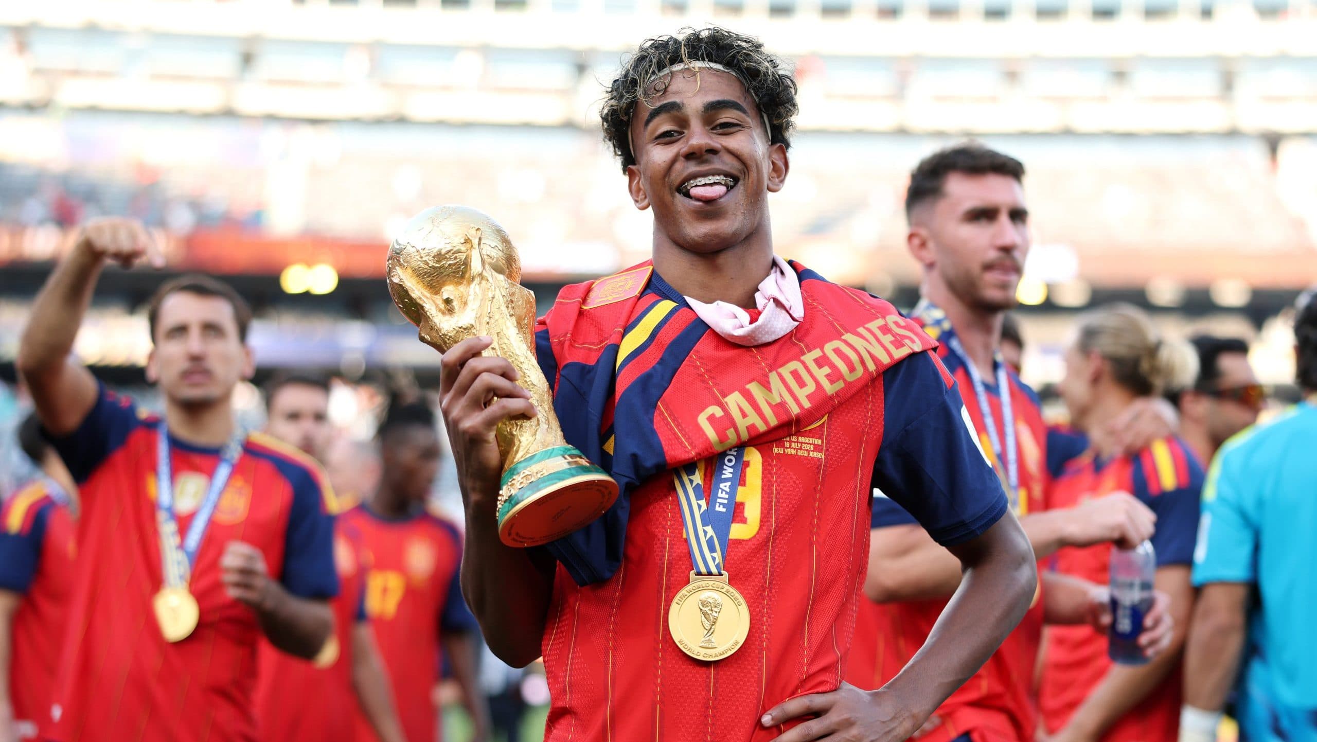 Spain's football team celebrating their World Cup victory amidst controversy.