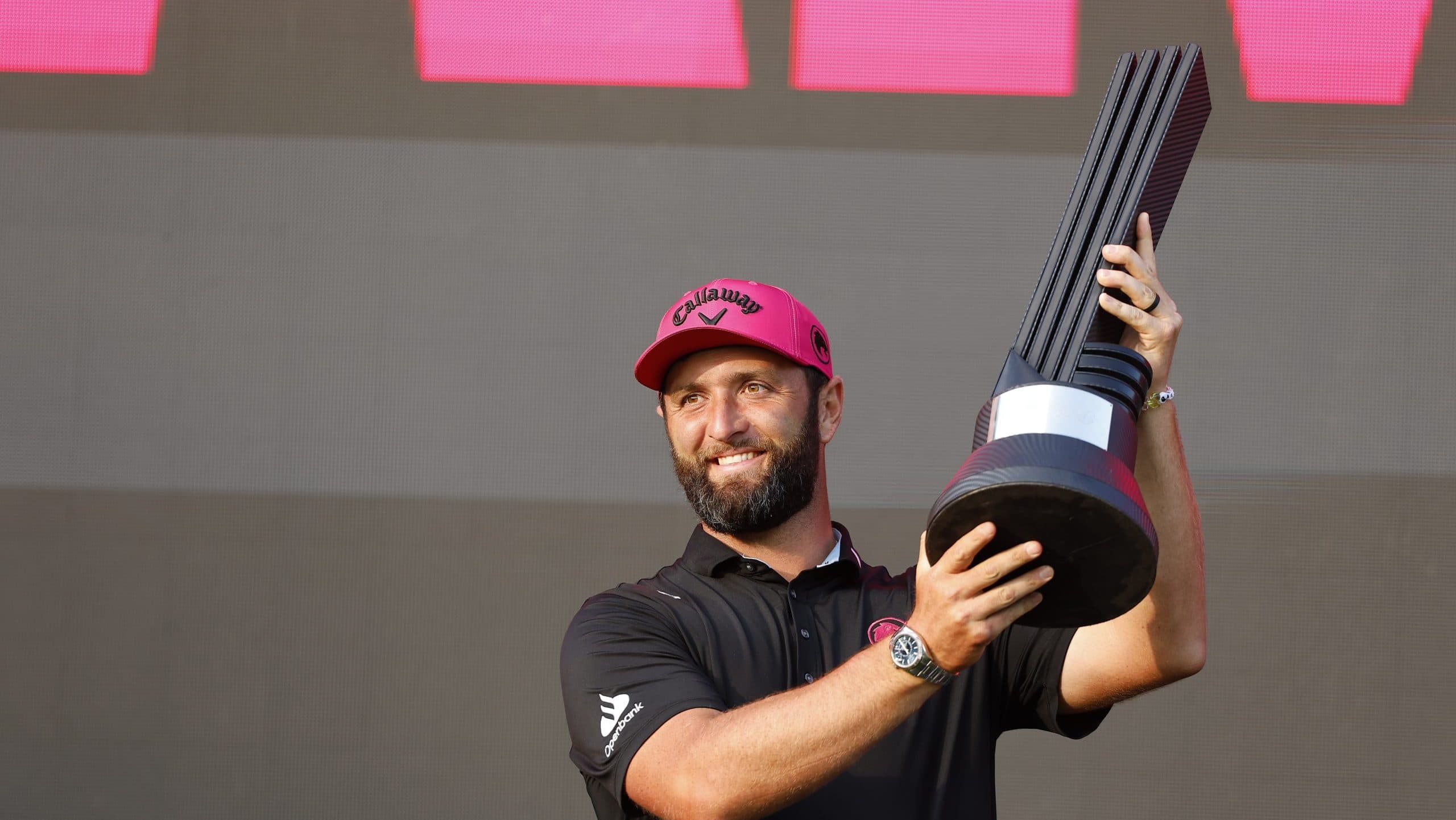 Jon Rahm celebrating his LIV Golf title amidst uncertainty about the league's future funding.