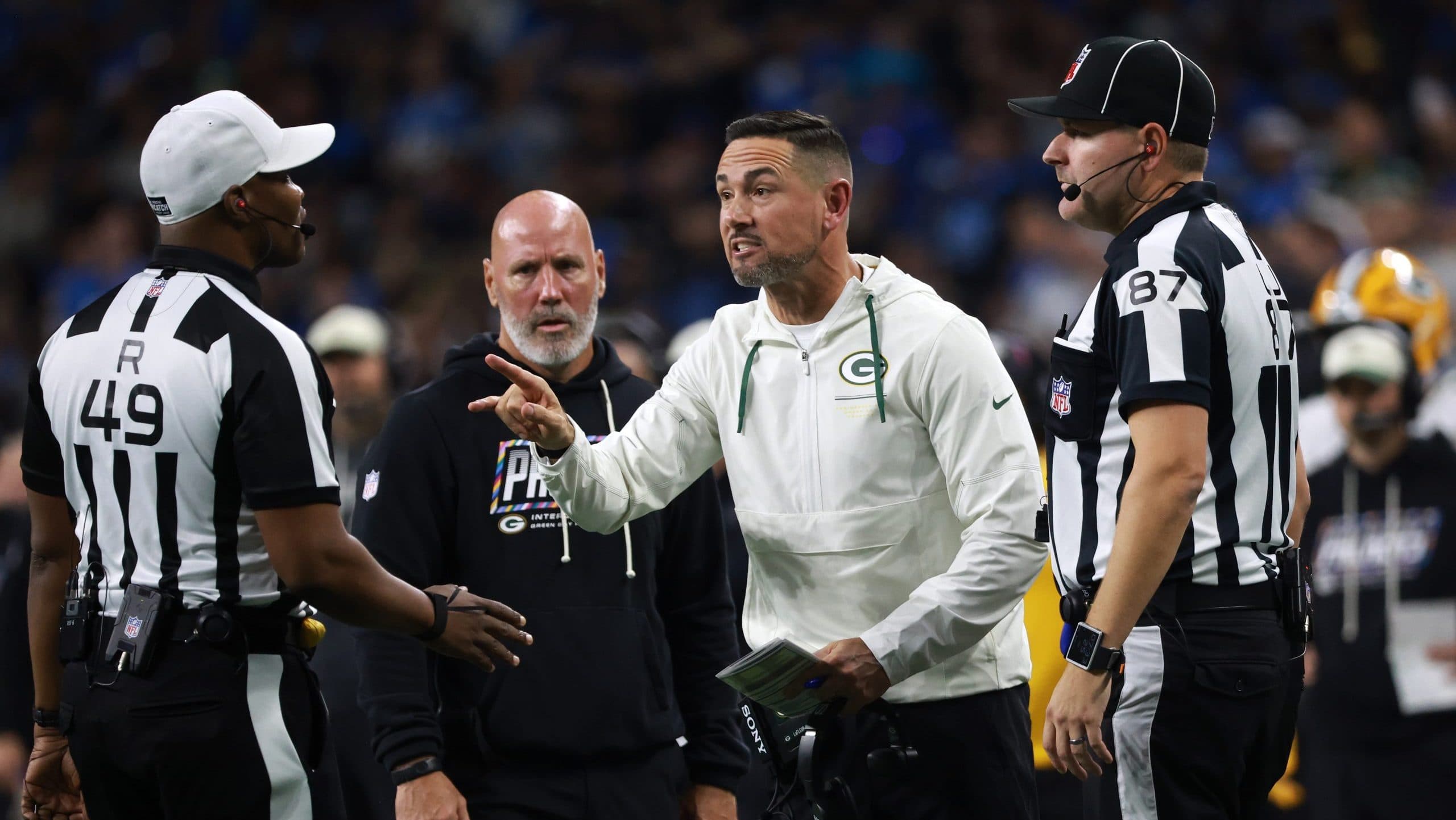 Broadcaster Tom Brady watches disputed calls during the Packers-Lions NFL officiating controversy game
