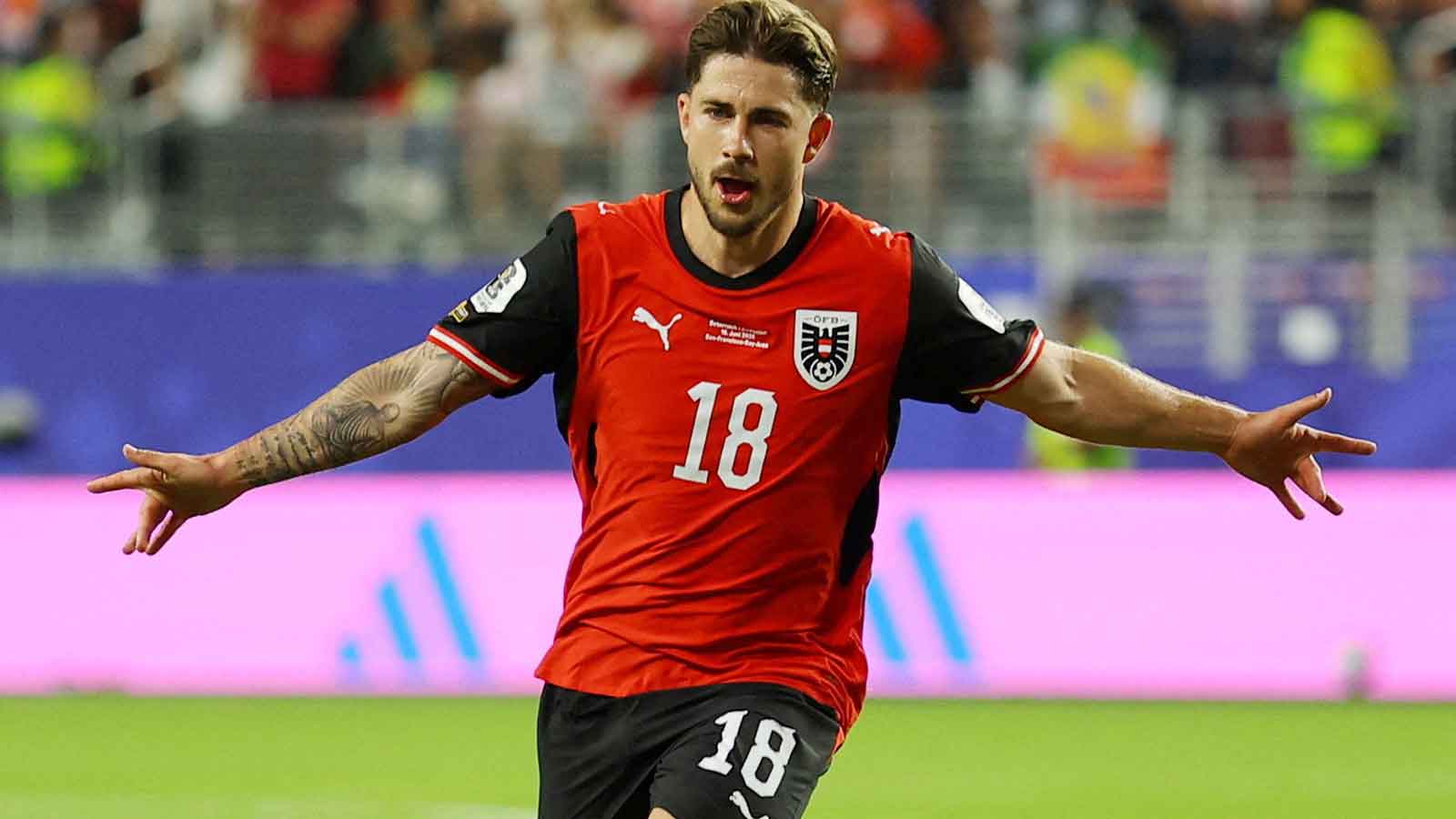 Romano Schmid celebrating his historic goal for Austria in the World Cup match against Jordan.
