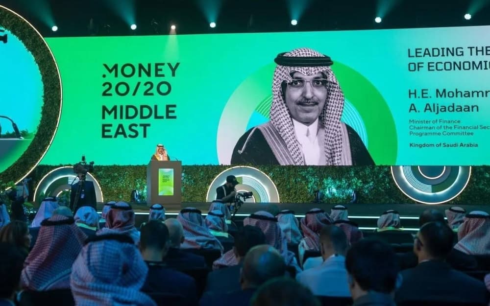 Saudi Finance Minister Mohammed Al-Jad'an speaking at the Money 20/20 conference, highlighting financial sector resilience.