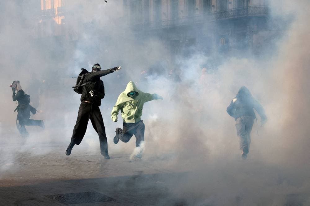 Protesters in Paris demonstrating against rising living costs and economic discontent.