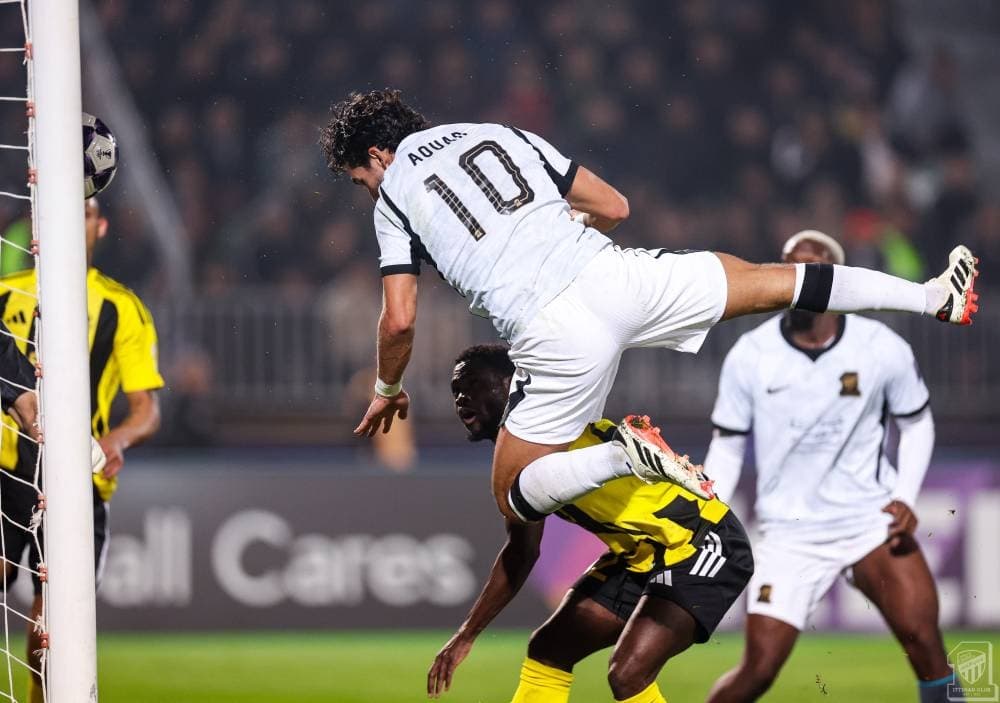 Minimalist score card showing Al-Ittihad 2-1 victory over Neftchi in the AFC Champions League Elite.